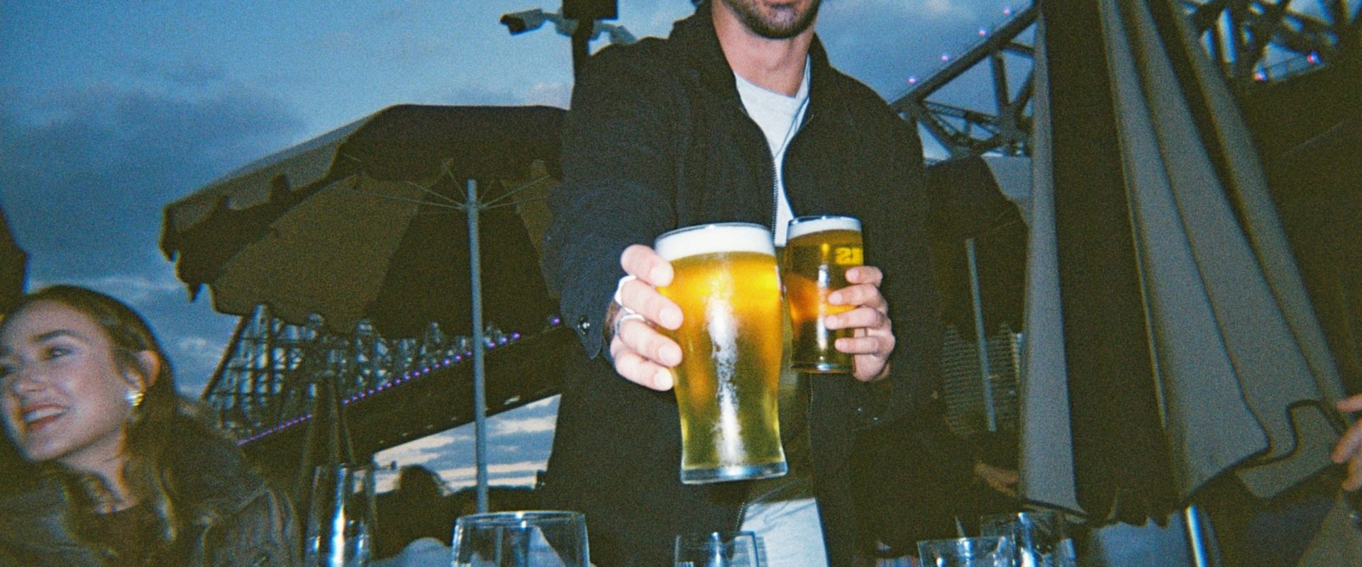 man sharing a beer